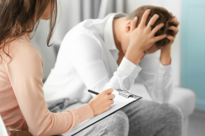 sad man at doctor's office