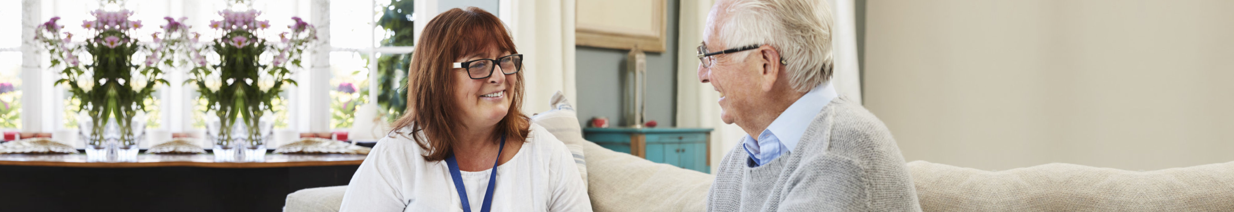 Female Support Worker Visits Senior Man At Home